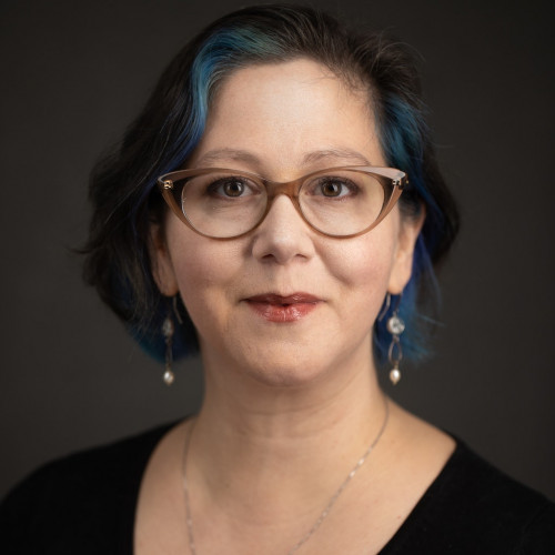 headshot of Allison Morris against a gray background